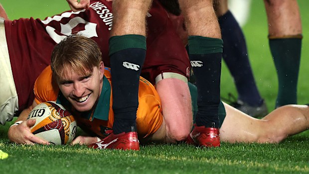 Tate McDermott of the Wallabies celebrates after scoring a try.
