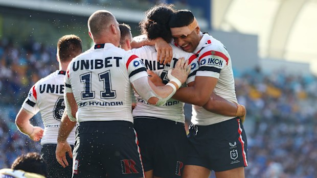 Sitili Tupouniua of the Roosters celebrates a try.