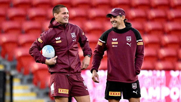 Kalyn Ponga shares a laugh with coach Billy Slater.