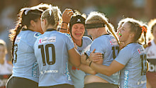 Emily Robinson of the Waratahs celebrates with team mates after scoring a try during the Super Rugby Women's Final.