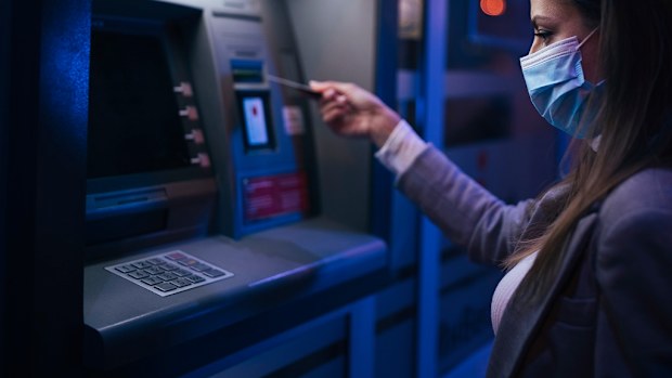 Woman using ATM