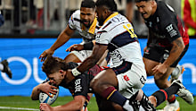 Johnny Lee of the Crusaders dives over to score a try.