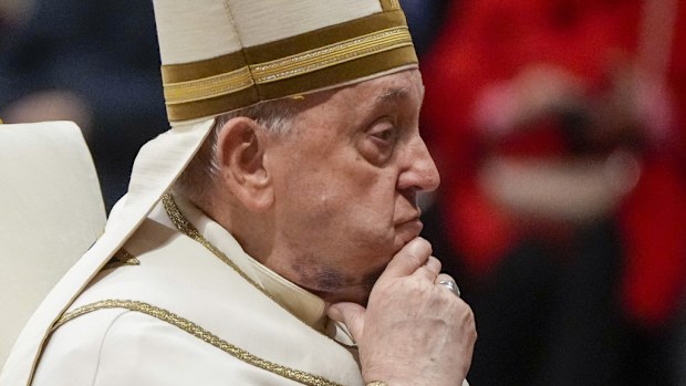 FILE - Pope Francis reacts during a solemn mass where he made 21 new cardinals in St. Peter's Basilica at The Vatican, Saturday, Dec. 7, 2024. (AP Photo/Gregorio Borgia, File)