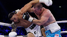  Sonny Bill Williams and Paul Gallen exchange punches during their heavyweight bout.