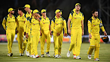 Australia walks off the field after the end of game one.