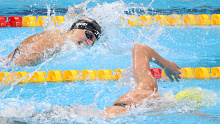 Katie Ledecky of Team Untied States (L) and Ariarne Titmus of Team Australia compete in the Women's 400 meter freestyle final.