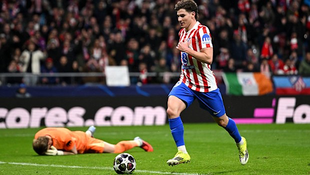 Julian Alvarez of Atletico Madrid scores his team's third goal as Antonin Kinsky lies dejected.