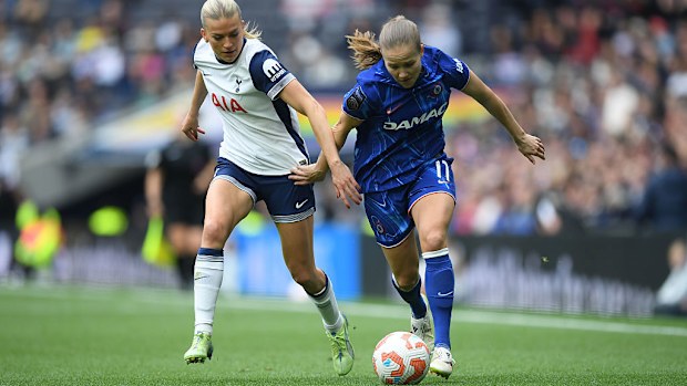 Guro Reiten of Chelsea is challenged by Charli Grant of Tottenham Hotspur.
