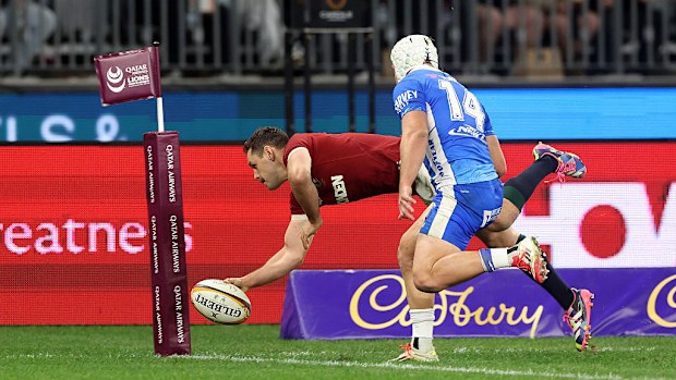 Tomos Williams of the British & Irish Lions dives in to score.