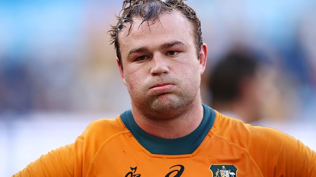 Harry Wilson of the Wallabies looks dejected after the team's defeat.
