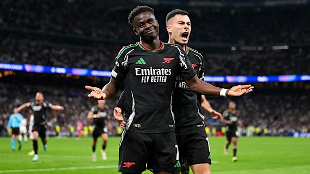 Bukayo Saka of Arsenal celebrates scoring with teammate Gabriel Martinelli.