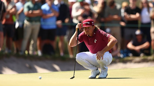 Cameron Smith lines up a putt on the 14th green.