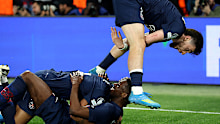 Ousmane Dembele of Paris Saint-Germain celebrates scoring his team's fifth goal with Khvicha Kvaratskhelia.