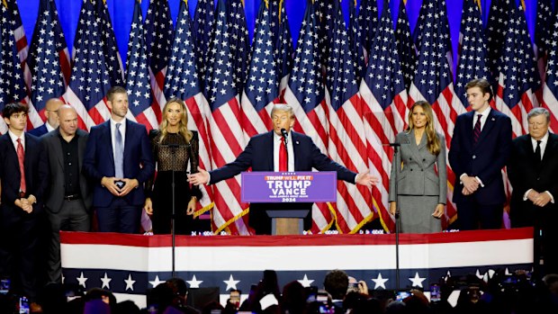Former US President Donald Trump, center, during an election night event at the Palm Beach Convention Center in West Palm Beach, Florida, US, on Wednesday, Nov. 6, 2024. Trump is on the cusp of recapturing the White House, projected as the winner across pivotal swing states with his party set to control the Senate and markets swinging in expectation of his possible victory. Photographer: Eva Marie Uzcategui/Bloomberg