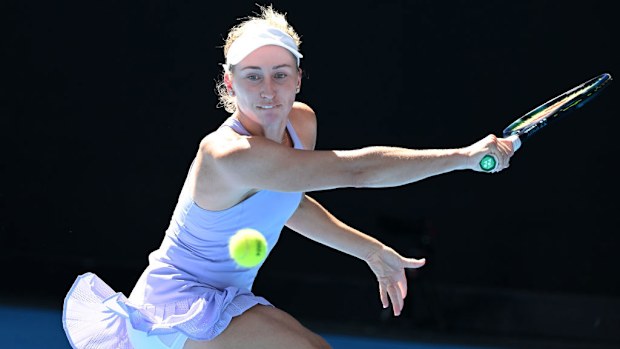 Daria Saville of Australia plays a backhand against Magdalena Frech of Poland.