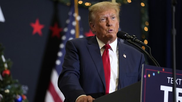 Former US President Donald Trump speaks during a commit to caucus rally, Tuesday, Dec. 19, 2023, in Waterloo, Iowa. 