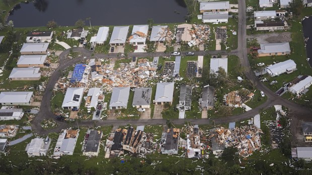 Neighborhoods destroyed by tornadoes are seen in this aerial photo in the aftermath of Hurricane Milton, Thursday, Oct. 10, 2024, in Fort Pierce, Fla. (AP Photo/Gerald Herbert)