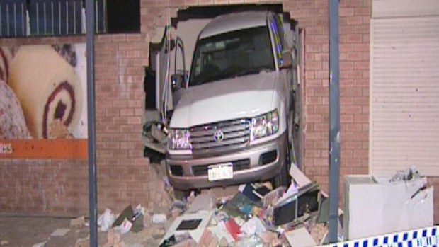A four-wheel-drive was stuck in the wall of the Perth centre. (9NEWS)