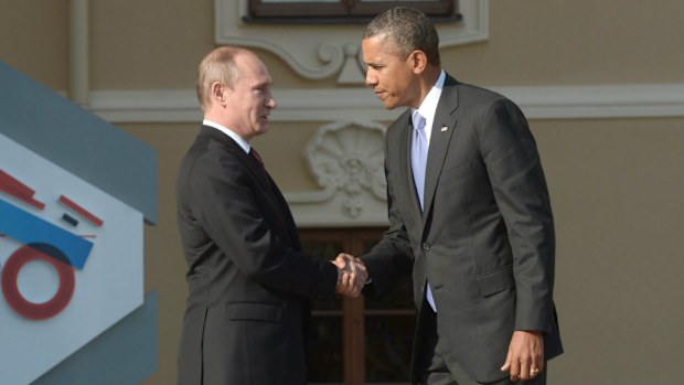 Russian President Vladimir Putin (L) shakes hands with US President Barack Obama (R) during welcome ceremony for participants arriving for the first working session of G20 summit in St. Petersburg, Russia, 05 September 2013. (AAP)