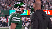 Aaron Rodgers glares at Saleh as he walks away.