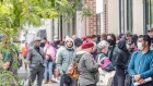 Massive lines of people lining up outside a Melbourne Centrelink office in March.