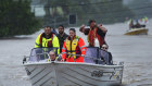 People are rescued by boat in Lismore on Monday