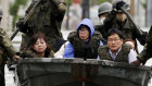 Self Defence Force members rescue residents on a flooded road hit by heavy rain in Fukuoka prefecture, southern Japan. 