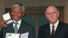 Nelson Mandela and FW de Klerk pose with their Nobel Peace Prize.