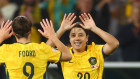 Australia’s Sam Kerr high fives Caitlin Foord after coming on as a substitute 