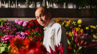 The artist in his studio. He “needs to touch [flowers] every day, to keep the relationship alive”.