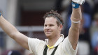 Australia's Steve Smith celebrates after scoring a century, applauded by captain Tim Paine during day two of the fourth Ashes Test cricket match between England and Australia at Old Trafford in Manchester, England.