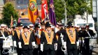 Orange order members march, in North Belfast, Northern Ireland.