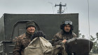 Ukrainian military vehicles move on the road in the freed territory of the Kharkiv region. Territory that took months to seize — at enormous cost of Russian blood and treasure — has been liberated in hours.