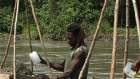 Children often work with their families mining gold in PNG.