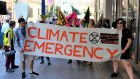 Griffith University honours graduate Cara Parsons (far right) attends a recent Extinction Rebellion protest in Brisbane.  