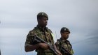 Questionable allegiances. Members of the military outside the Planalto Palace following attacks on government buildings by supporters of former Brazilian President Jair Bolsonaro in Brasilia.