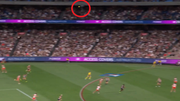 The ball was kicked so high that it hit the camera.