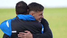 Brent Harvey hugs his son Cooper, who is set to make his AFL debut for North Melbourne.