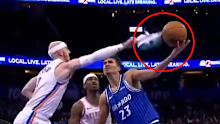 Alex Caruso blocks a shot with his shoe.