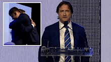 Luke Beveridge presents outgoing midfielder Josh Dunkley with the Charles Sutton Medal for the Western Bulldogs' best and fairest player.