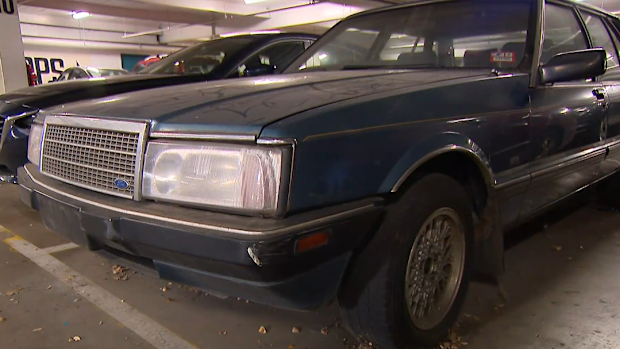 An abandoned 1986 Ford Fairlane which has been parked at Melbourne's Northcote Plaza Shopping Centre for at least a decade has been shrouded in mystery - until now.