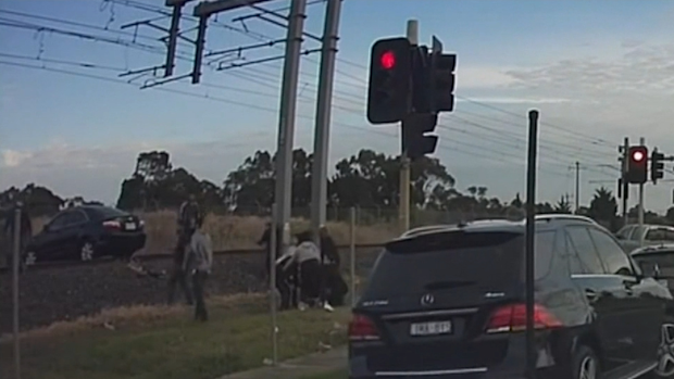 Melbourne driver rescued moments before train hits car | Nine.com.au