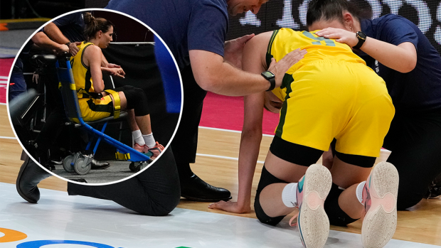 Australia's Bec Allen is taken from the arena by medical staff.