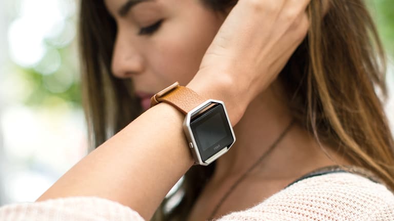 wearing apple watch and fitbit