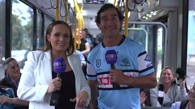 Johnathan Thurston wears a Cronulla Sharks jersey.