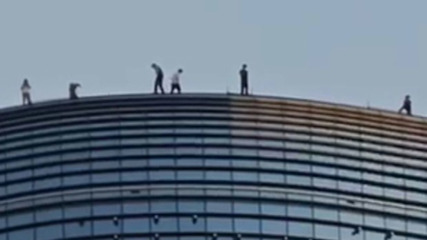 Several daredevils have been caught risking their lives walking on the edge of a Melbourne CBD skyscraper.