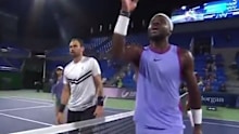 Frances Tiafoe takes his frustration out on the chair umpire.
