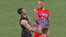 Sydney Swans superstar Lance Franklin strikes former Richmond captain Trent Cotchin in the face.