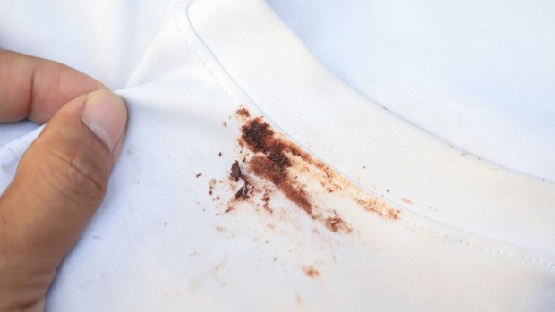 A chocolate stain on white clothing.