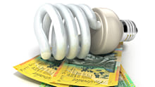 Energy saving light bulb and Australian Dollars. Isolated on white.Related images: